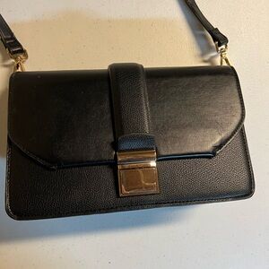 Medium sized cross body black bag